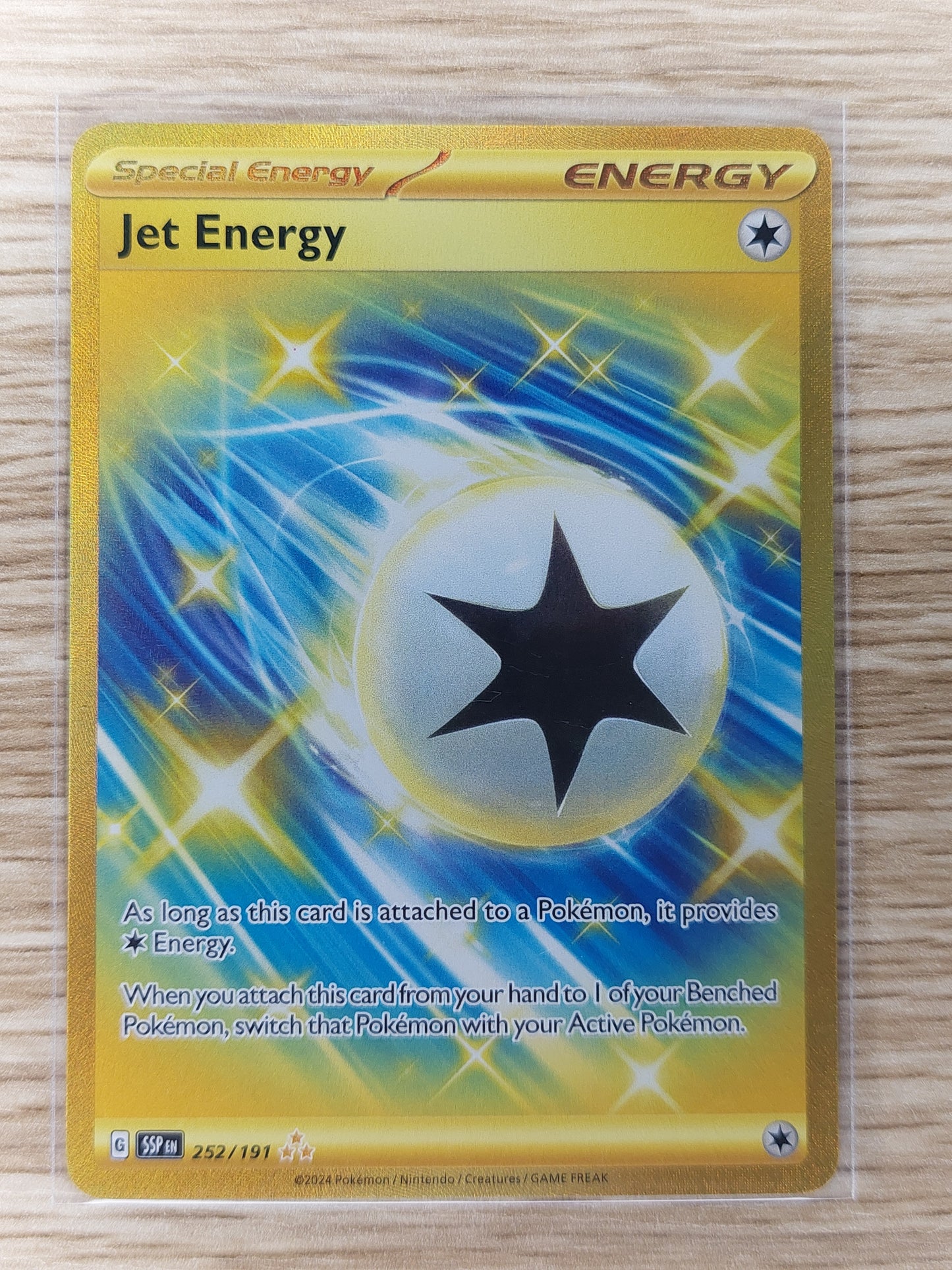 Pokemon 2024 Jet Energy Gold Trainer Surging Sparks 252/191