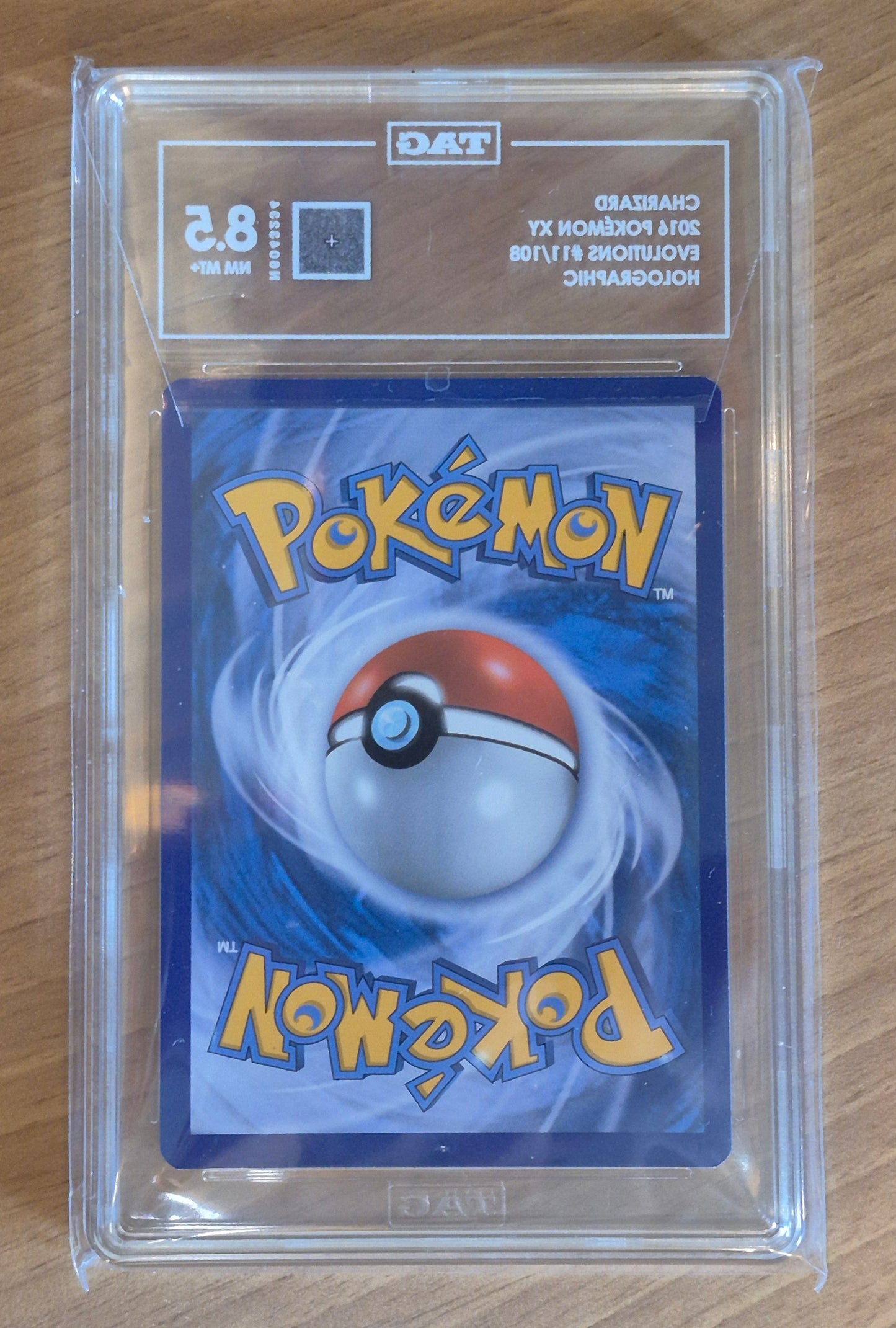 2016 Pokémon Evolutions 11/108 Charizard Holo TAG 8.5 NM MT+