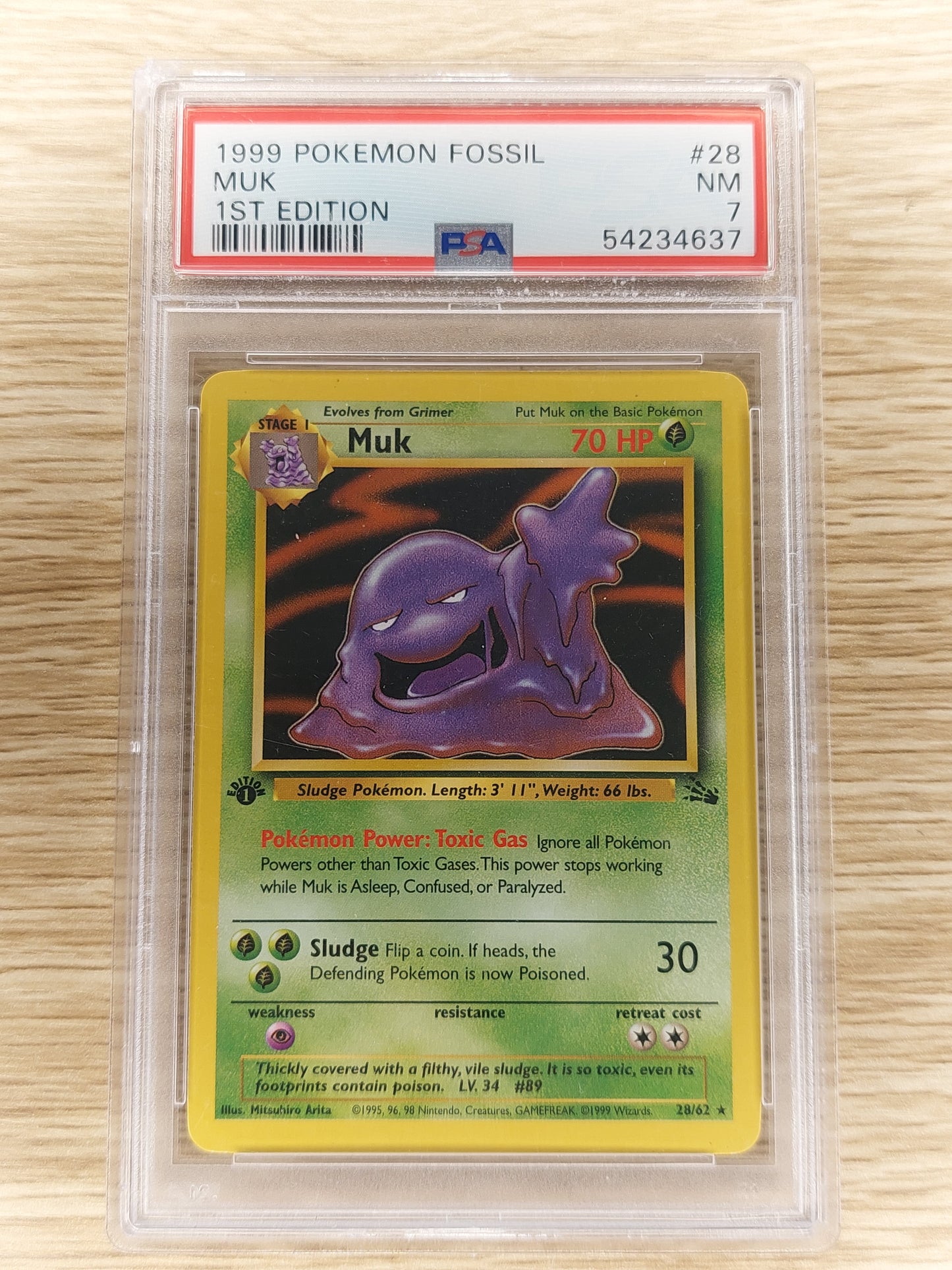 1999 Pokemon TCG Fossil 28/62 Muk Non Holo 1st Edition PSA 7