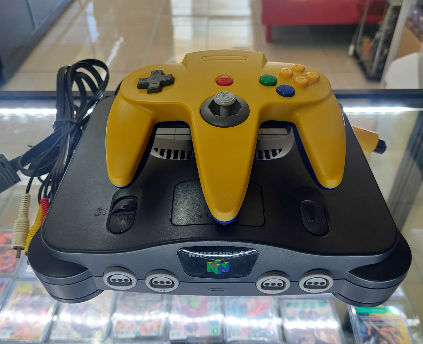 1996 Nintendo N64 Console complete with power,av + brand new Yellow/Blue aftermarket controller. Tested VGC