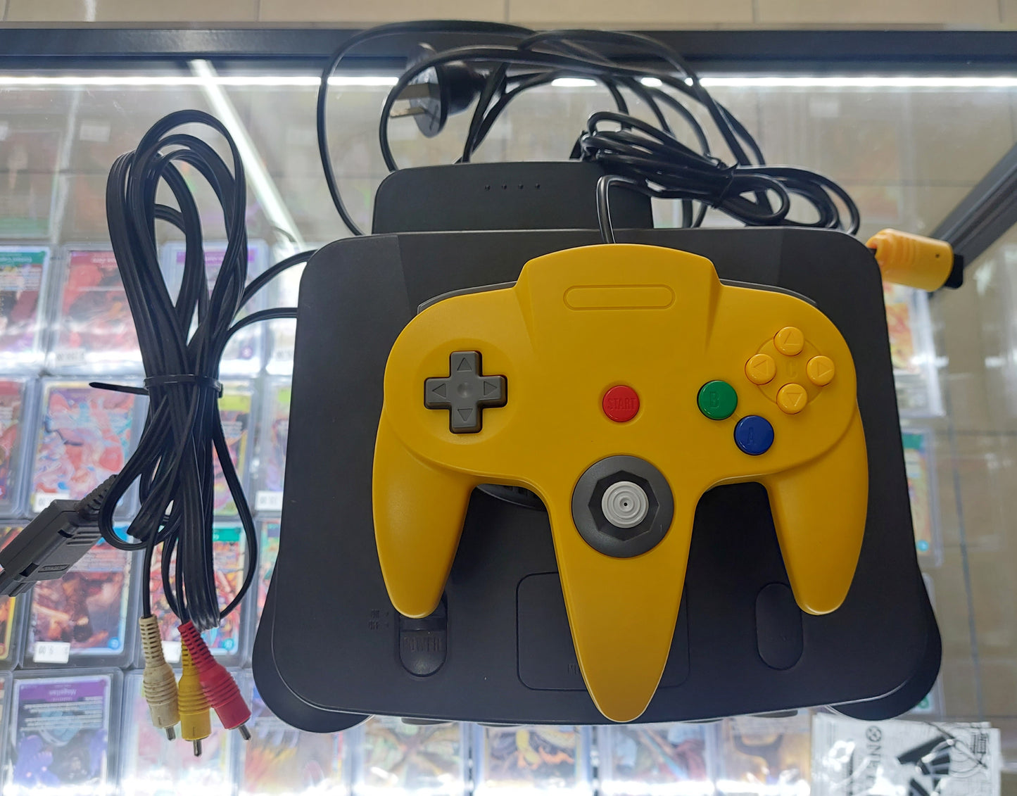 1996 Nintendo N64 Console complete with power,av + brand new Yellow/Blue aftermarket controller. Tested VGC