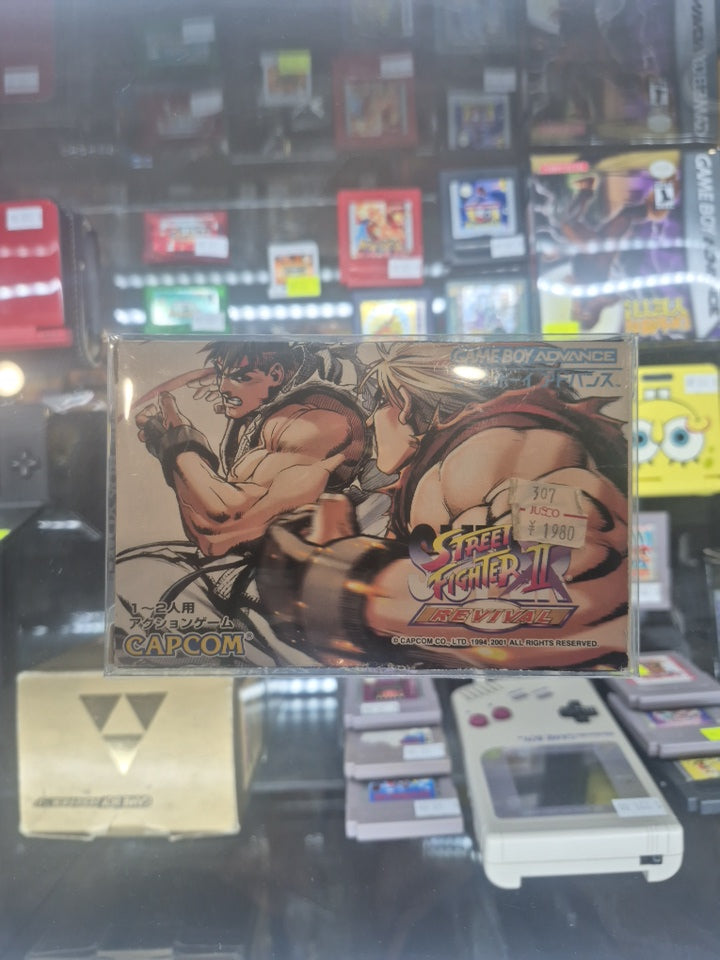 2001 Japanese Gameboy Advance Capcom Street Fighter ll boxed w/ revival guide book.