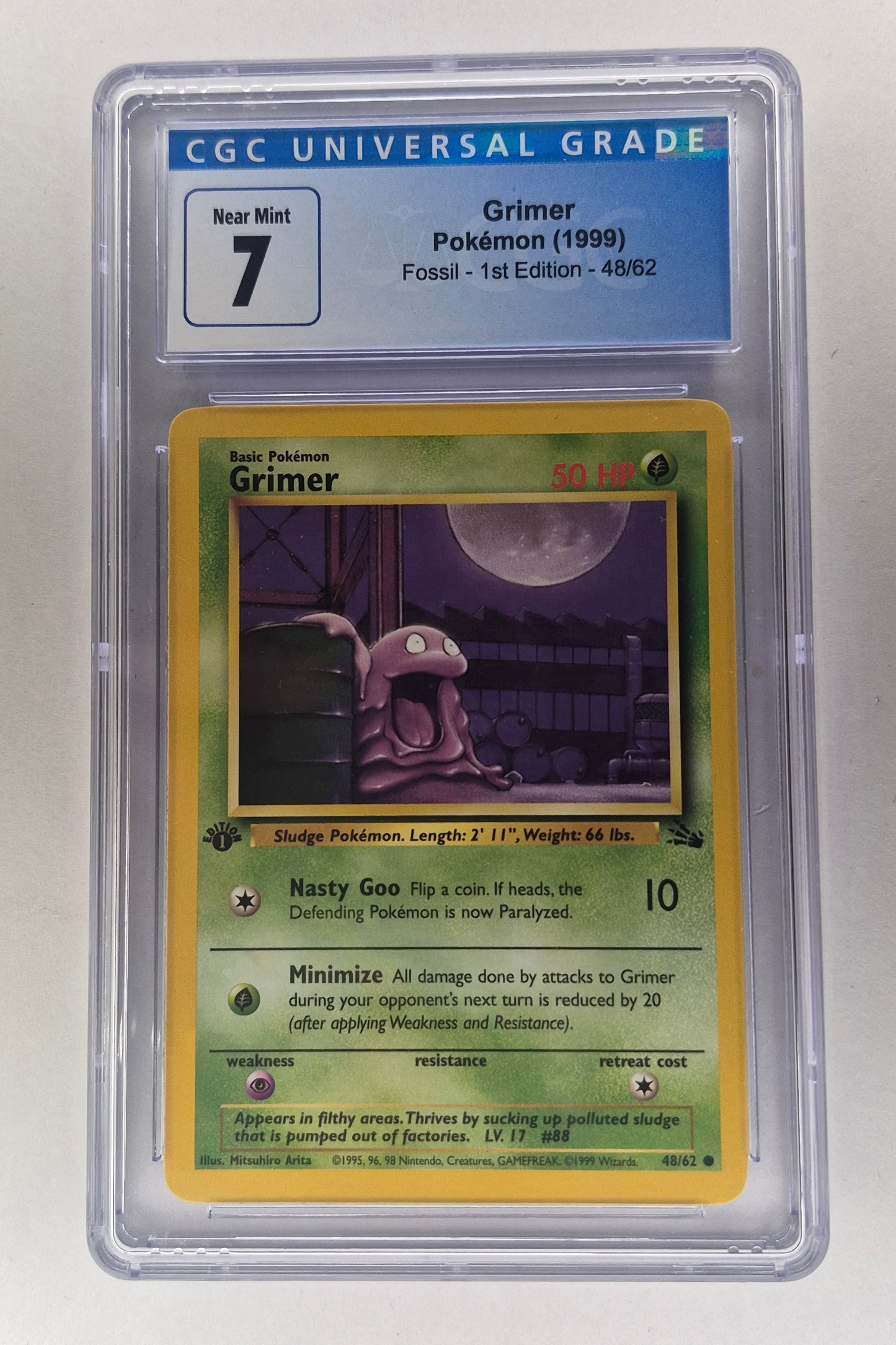 1999 Pokémon Fossil 1st edition Grimer Non-Holo 48/62 CGC 7